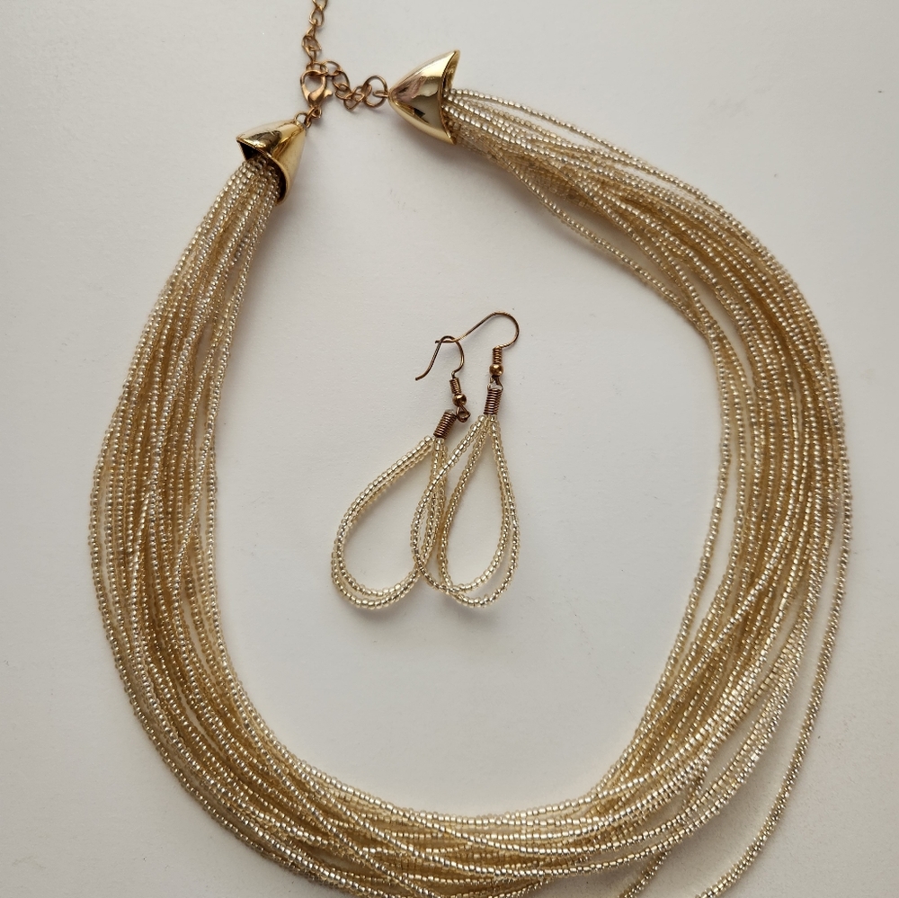 Gold filament multi-strand choker w/ earrings.